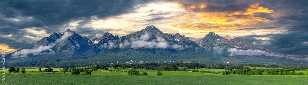 Panoramic view of Tatra mounains. Landscape of High Tatras in the spring. Snowy mountain tops and beautiful sky. - obrazy, fototapety, plakaty 