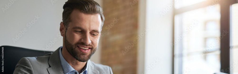 Business company employee smiling at his workplace Business company employee smiling at his workplace