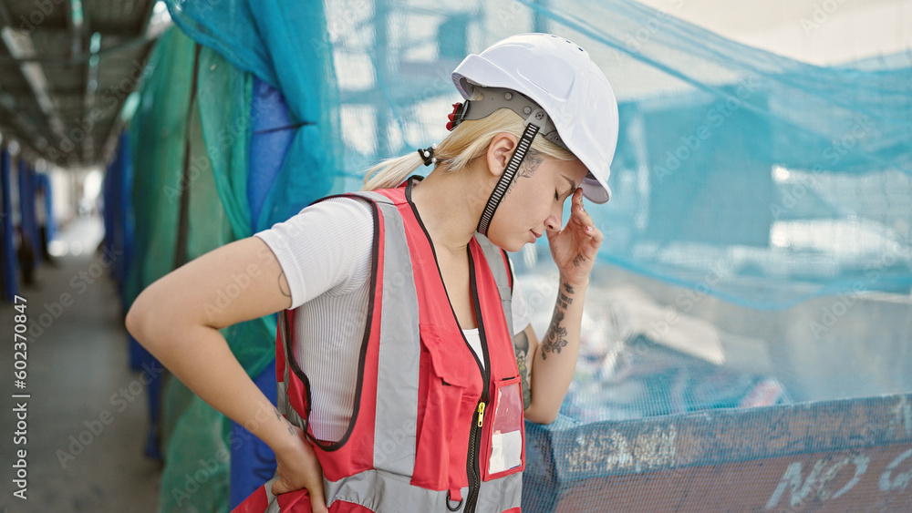 Young beautiful hispanic woman architect stressed at street