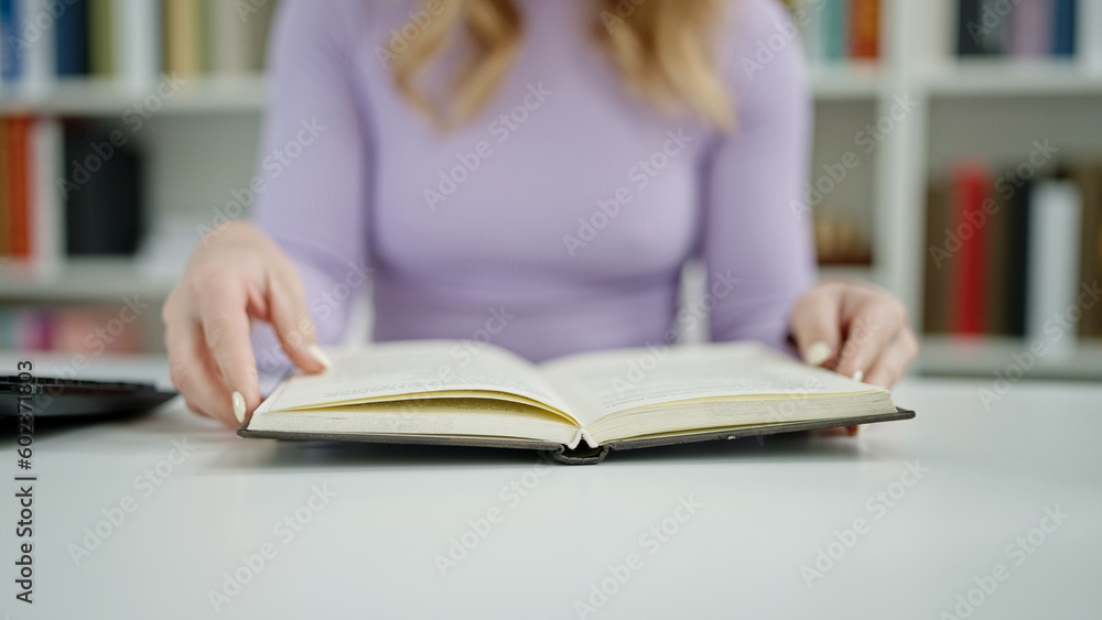 Young beautiful hispanic woman with open book at library university Young beautiful hispanic woman with open book at library university