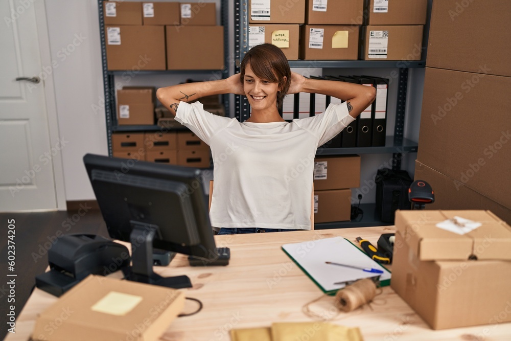 Young beautiful hispanic woman ecommerce business worker relaxed with hands on head at office Young beautiful hispanic woman ecommerce business worker relaxed with hands on head at office
