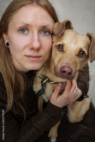 Obraz na płótnie Portrait of beautiful blonde girl with a dog w salonie