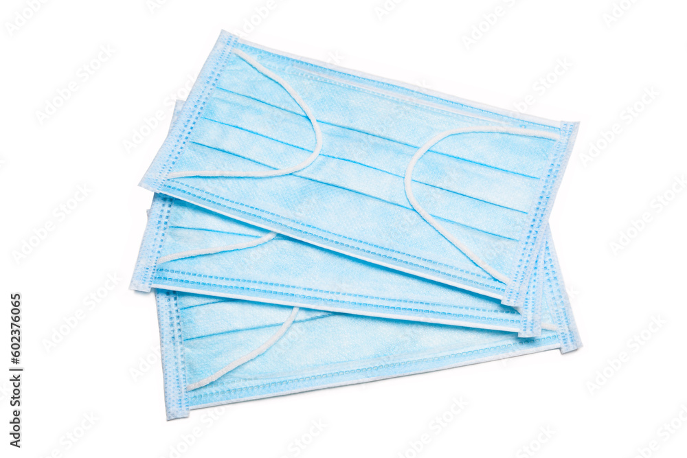 Medical protective masks in blue color isolated on white Medical protective masks in blue color isolated on white