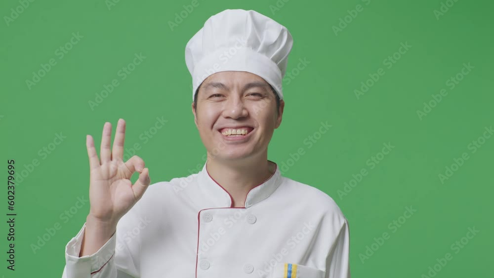 Close Up Of Asian Man Chef Smiling And Showing Okay Gesture To Camera While Standing In The Green Screen Background Studio
Close Up Of Asian Man Chef Smiling And Showing Okay Gesture To Camera While Standing In The Green Screen Background Studio