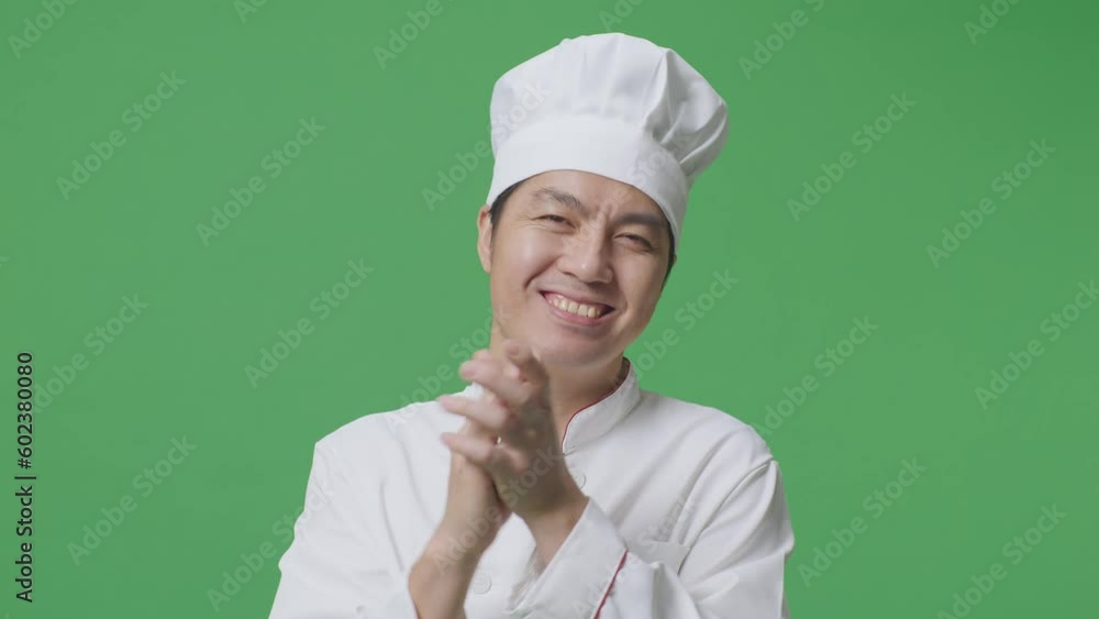 Close Up Of Asian Man Chef Smiling And Clapping His Hands While Standing In The Green Screen Background Studio
Close Up Of Asian Man Chef Smiling And Clapping His Hands While Standing In The Green Screen Background Studio