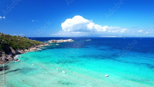 Italy summer holidays. Sardegnia island . village Santa Teresa di Galura in northern part with turquoise sea . aerial drone video photo