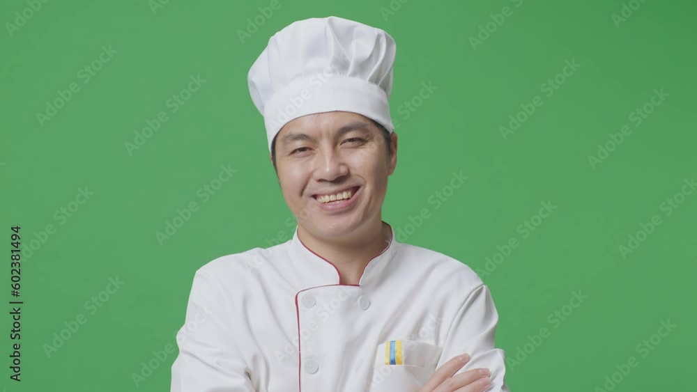 Close Up Of Asian Man Chef Smiling And Crossing His Arms To Camera While Standing In The Green Screen Background Studio
Close Up Of Asian Man Chef Smiling And Crossing His Arms To Camera While Standing In The Green Screen Background Studio