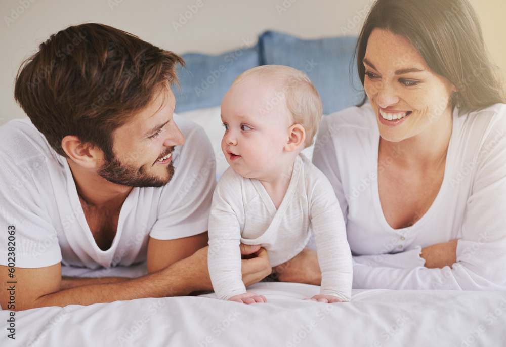 Happy family, mother and father with baby on bed for love, care and quality time together at home. Mom, dad and cute newborn child relaxing in bedroom for happiness, support and development of kids Happy family, mother and father with baby on bed for love, care and quality time together at home. Mom, dad and cute newborn child relaxing in bedroom for happiness, support and development of kids