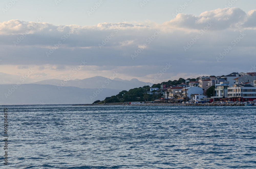 scenic view of Cesme harbor and coast at sunset (Izmir province, Turkiye) 