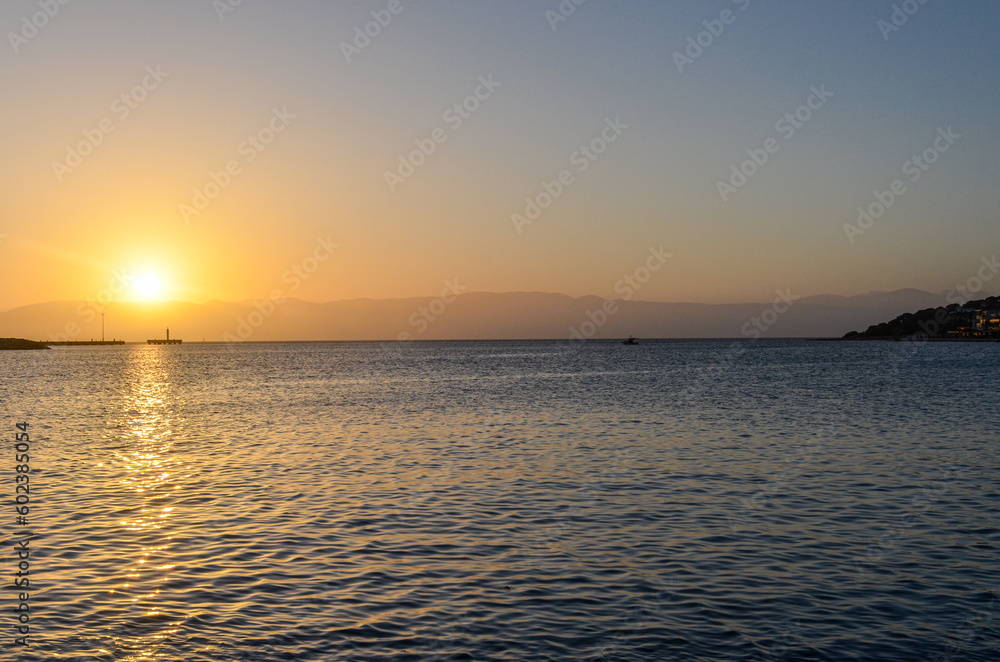 scenic view of Cesme harbor and Chios island at sunset (Izmir province, Turkiye) 