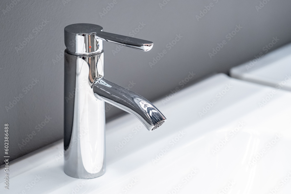 Stainless steel water tap or chrome faucet in the bathroom Stainless steel water tap or chrome faucet in the bathroom