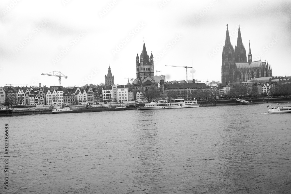 Cologne, Germany. Famous Hohenzollern Bridge over Rhine river. Buildings in historic city centre