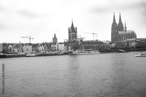 Cologne, Germany. Famous Hohenzollern Bridge over Rhine river. Buildings in historic city centre