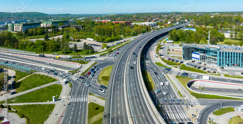 Multilevel city highway junction in Krakow, Poland. One highway on the top level, the second one in the tunnel, the turnaround with traffic lights and zebra crossings on the middle level. Aerial view