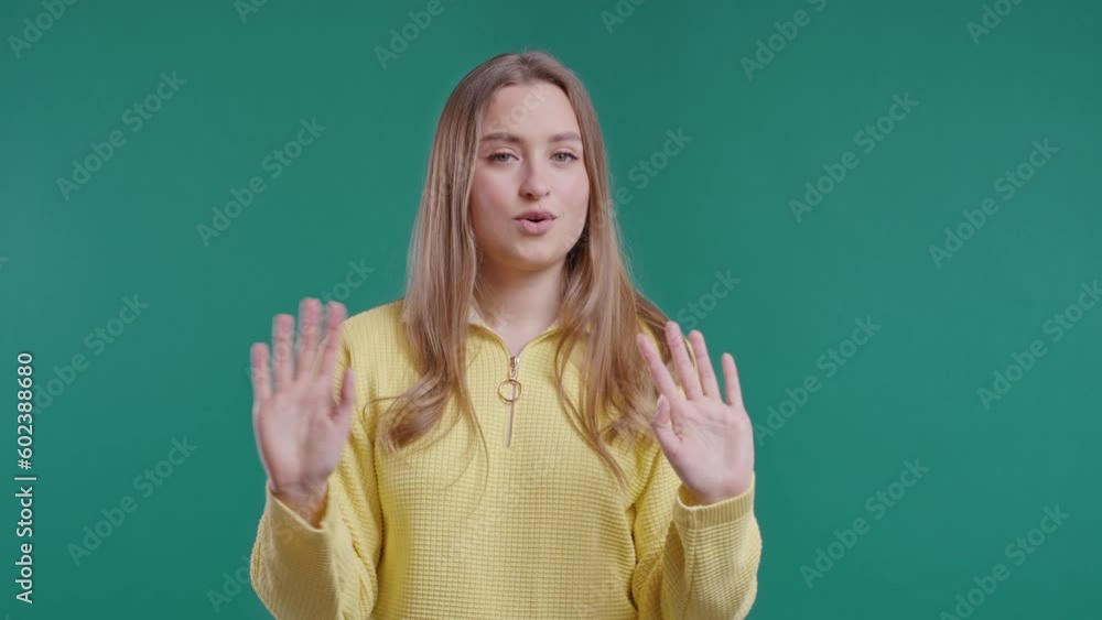 Uninterested woman disapproving with NO hands sign gesture. Denying, rejecting Uninterested woman disapproving with NO hands sign gesture. Denying, rejecting