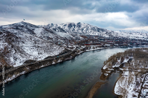 aerial view of mountain near the Irtysh river, the city landmark of Ust-Kamenogorsk, the road at the foot of the mountains, picturesque view of the Altai ridge