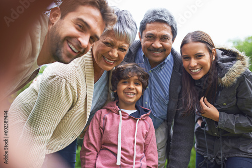 Selfie, smile and faces of a big family in nature on an outdoor adventure, travel together in portrait. Happy, love and boy child taking picture with grandparents and parents on holiday or vacation © Hova/peopleimages.com