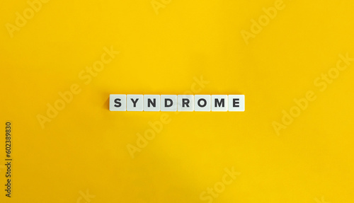 Syndrome Word and Concept. Letter Tiles on Yellow Background. Minimal Aesthetics.