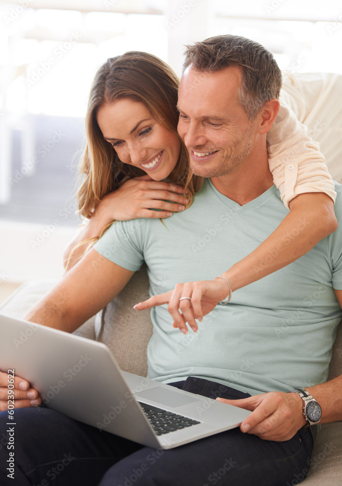 Happy couple, computer and pointing on home internet for online planning, website and to check application together. Hug, love and mature partner, woman or people on sofa reading on laptop technology Happy couple, computer and pointing on home internet for online planning, website and to check application together. Hug, love and mature partner, woman or people on sofa reading on laptop technology