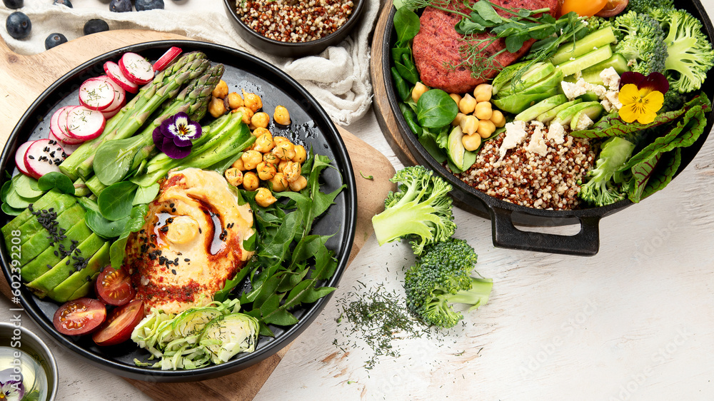 Healthy vegetarian and vegan salads and Buddha Bowls with vitamins, antioxidants, protein on light background. Healthy vegetarian and vegan salads and Buddha Bowls with vitamins, antioxidants, protein on light background.