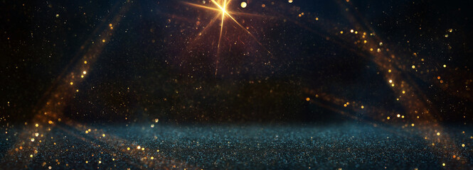 background of abstract glitter lights. gold, blue and black. de focused