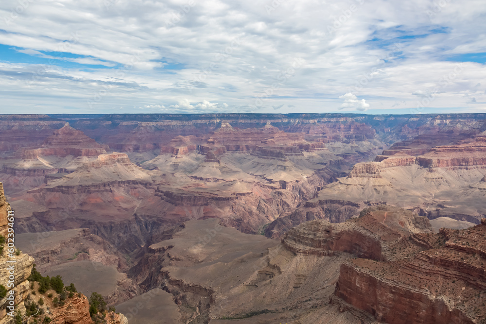 Panoramic aerial view from South Kaibab hiking trail at South Rim of Grand Canyon National Park, Arizona, USA, America. Colorado River weaving through valleys and rugged terrain. Natural world wonder