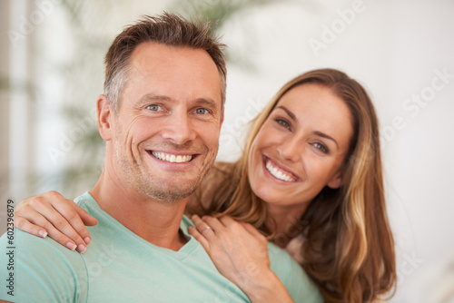 Portrait, love and couple with romance, hug and happiness with bonding, loving and affection. Face, man or woman embrace, quality time and partnership with joy, romantic or cheerful with relationship