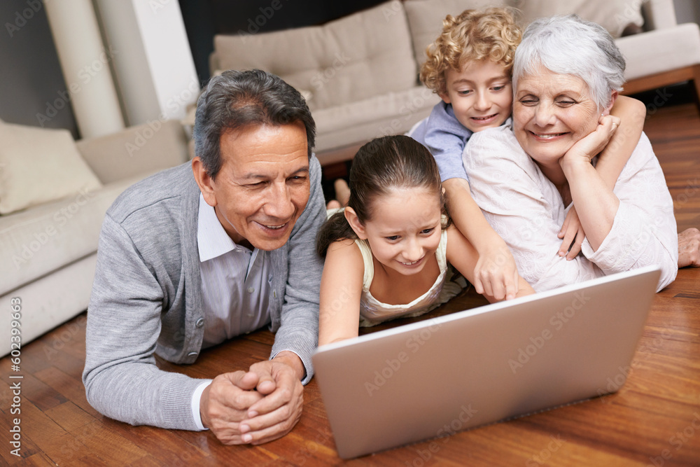 Laptop, floor or grandparents with happy kids for movie streaming online subscription in retirement at home. Children siblings, relax or grandmother watching videos on internet with a senior old man Laptop, floor or grandparents with happy kids for movie streaming online subscription in retirement at home. Children siblings, relax or grandmother watching videos on internet with a senior old man