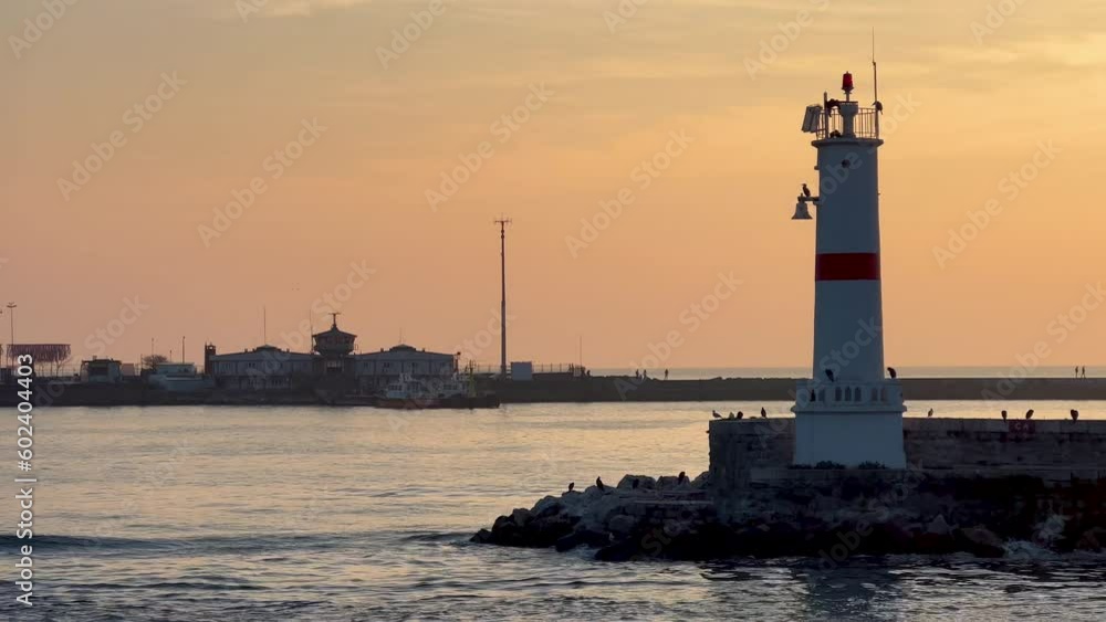 Amazing sailing past lighthouse in Bosphorus, seagulls flying, the sunset background, 4K Amazing sailing past lighthouse in Bosphorus, seagulls flying, the sunset background, 4K