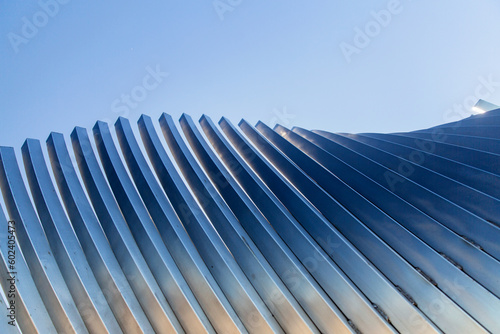 architecture and site concept - close up of modern building construction part over blue sky © Syda Productions