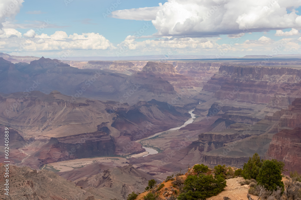 Panoramic aerial view seen from Desert View Point at South Rim of Grand Canyon National Park, Arizona, USA, America. Colorado River weaving through valleys and rugged terrain. Natural world wonder
