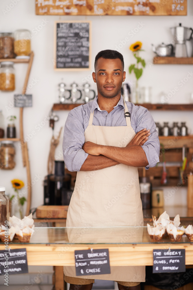 Black man, portrait and waiter with arms crossed in cafe with pride for career or job. Barista, serious and confidence of African person from Nigeria in restaurant, small business and coffee shop. Black man, portrait and waiter with arms crossed in cafe with pride for career or job. Barista, serious and confidence of African person from Nigeria in restaurant, small business and coffee shop.