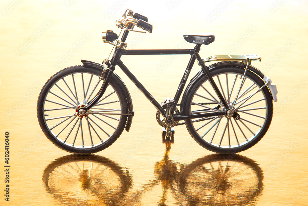 Fototapeta premium road bike model on a yellow background. transport for travel