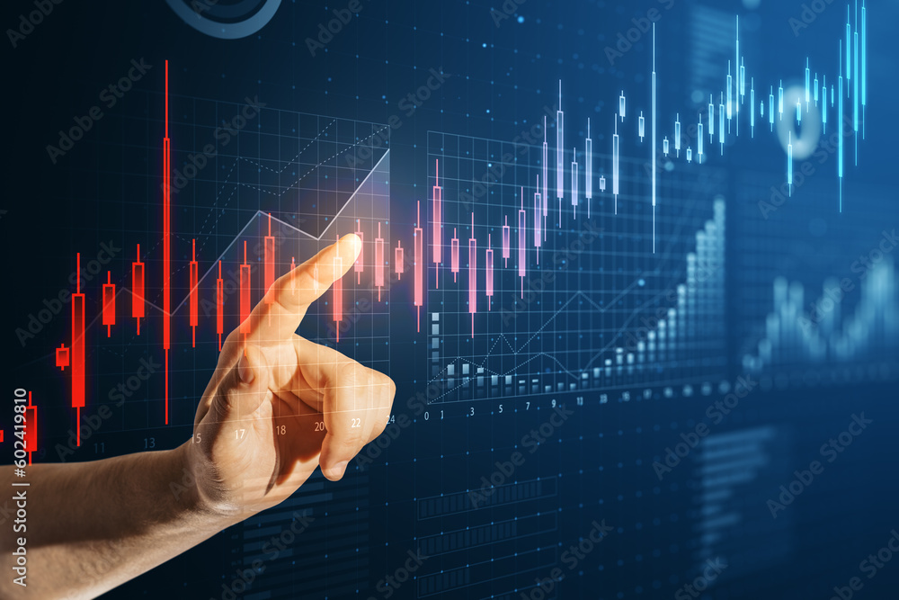 Close up of man hand pointing at abstract glowing candlestick business chart on blue background. Trade, finance and market concept. Close up of man hand pointing at abstract glowing candlestick business chart on blue background. Trade, finance and market concept.