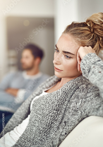 Argument, stress and sad woman in a fight with her boyfriend in the living room of their apartment. Divorce, depression and young female person with conflict or breakup i couple therapy for marriage