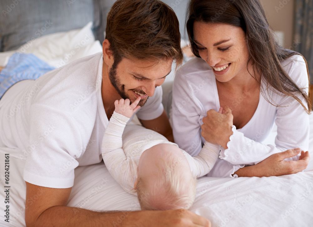 Mom, dad and baby in bedroom for love, care and quality time together. Happy family, parents and newborn child relaxing on bed with smile, childhood development and support to nurture kids at home Mom, dad and baby in bedroom for love, care and quality time together. Happy family, parents and newborn child relaxing on bed with smile, childhood development and support to nurture kids at home