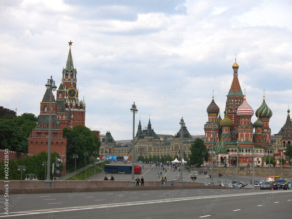 panorama of Red Square in Moscow: St. Basil's Cathedral, Spasskaya Tower of the Kremlin, tourist buses panorama of Red Square in Moscow: St. Basil's Cathedral, Spasskaya Tower of the Kremlin, tourist buses
