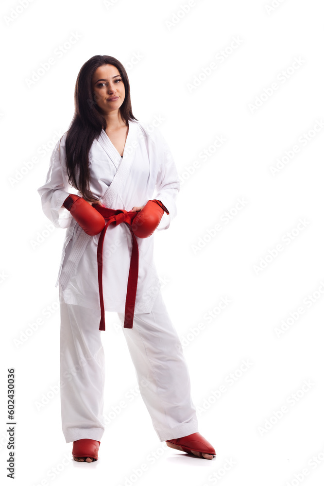 girl wearing kimono and red gloves exercising karate against white background girl wearing kimono and red gloves exercising karate against white background