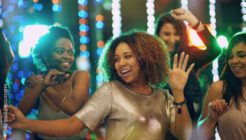 Obraz na plátne Happy woman, dance and party in nightclub with friends, social event and new year concert