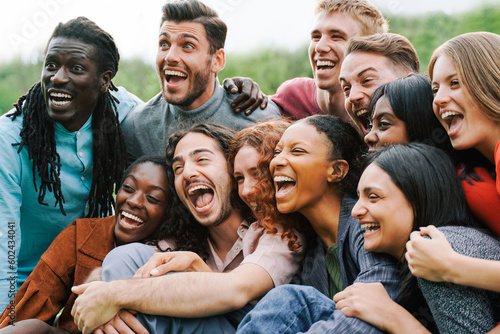 Multiethnic happy group of people having fun outdoor - Focus on center African girl