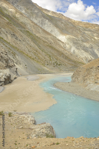 Conjunction of the Zanskar and Indus rivers flowing in between beautiful dry mountains in Nimmu Valley, Ladakh, INDIA. 