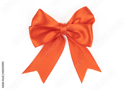 Red satin ribbon bow isolated on white background, close up.