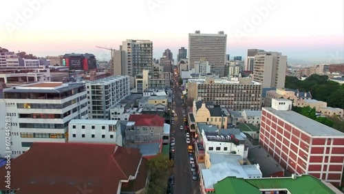 Cityscape with city buildings in industrial or residential location with aerial drone view. Urban infrastructure and architecture in Cape Town, South Africa with skyline and a long street or road