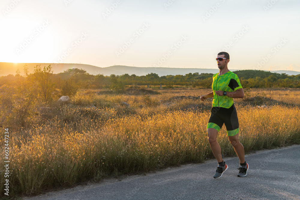 Triathlete in professional gear running early in the morning, preparing for a marathon, dedication to sport and readiness to take on the challenges of a marathon. Triathlete in professional gear running early in the morning, preparing for a marathon, dedication to sport and readiness to take on the challenges of a marathon.