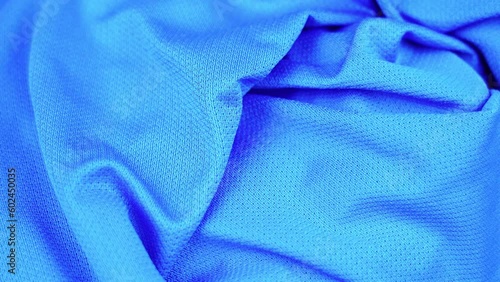 fashionable blue sportswear of nylon fabric rotates closeup