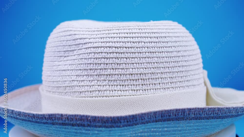 stylish summer hat of white colour with decorative strip stylish summer hat of white colour with decorative strip