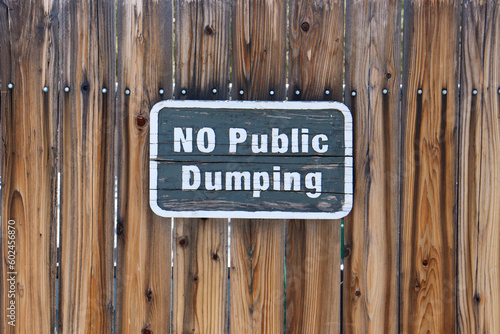 No Public Dumping Wooden Sign on Wooden gate.
