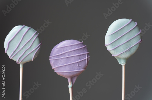 Colorful homemade cake pops with gray background