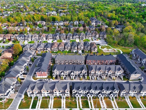 Aerial view of new development of townhomes and detached houses neighbourhood at Richmond Hill, Ontario, Canada. City new development and real estate housing background.