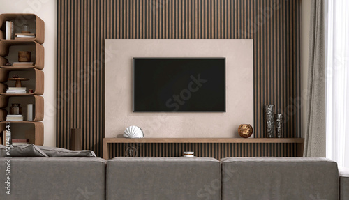 Luxury beige wall living room, modern flat television on brown wood panel wall, gray leather sofa, mid century style shelf in sunlight from window white sheer curtain for interior design background 3D